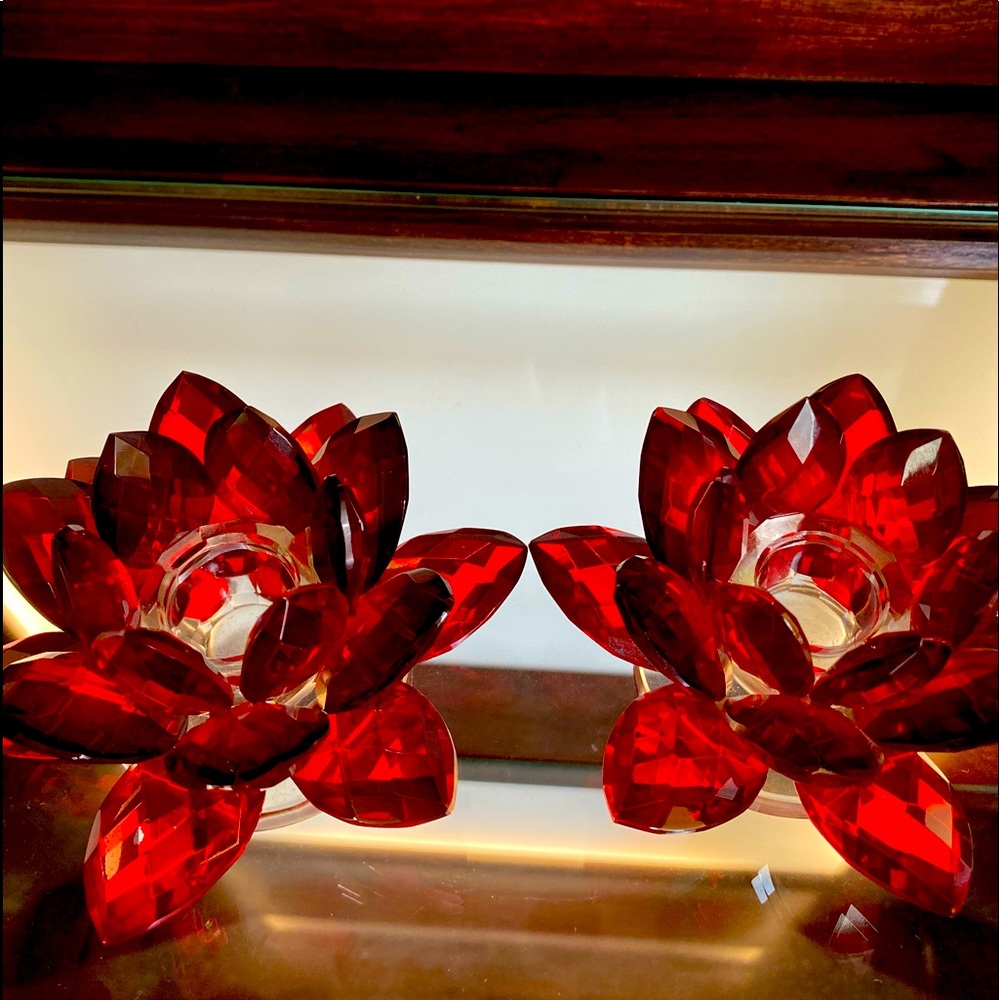 Two red crystal flower candle holder’s.